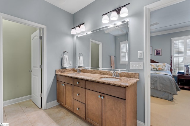 bathroom featuring vanity, tile patterned floors, plenty of natural light, and ornamental molding