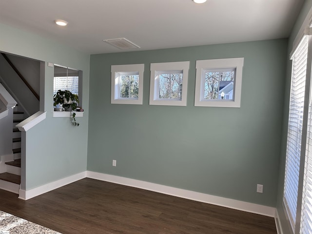 unfurnished room with dark hardwood / wood-style floors