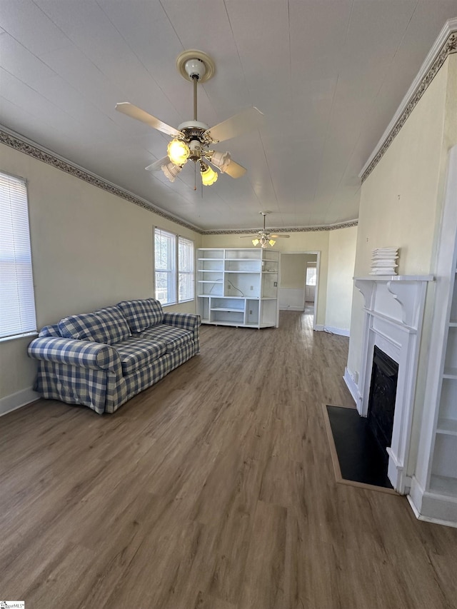 living room with hardwood / wood-style flooring and ceiling fan