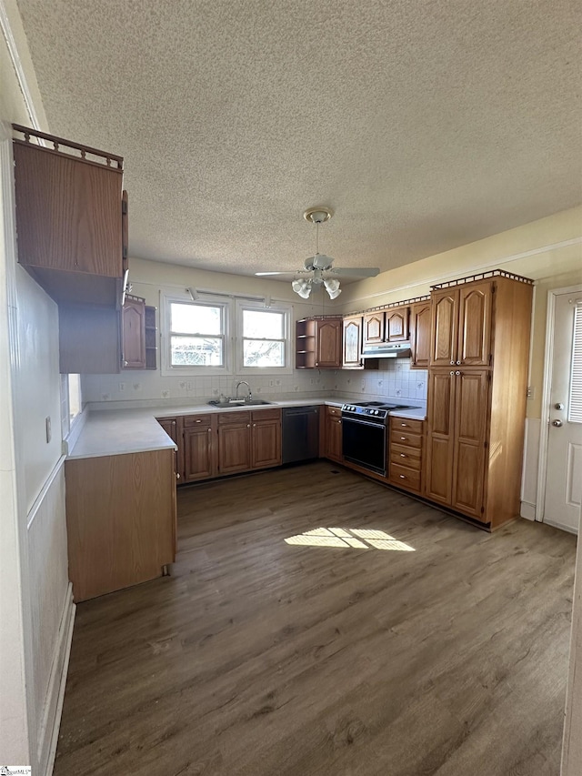 kitchen featuring dishwasher, dark wood-type flooring, sink, ceiling fan, and range with electric stovetop