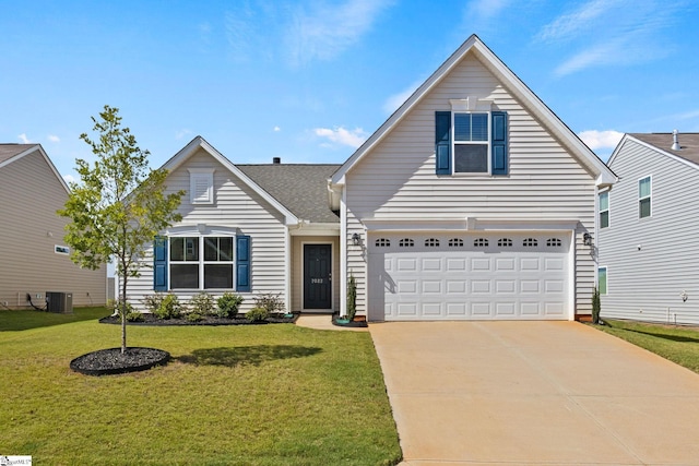 view of front property with a front yard, central AC, and a garage