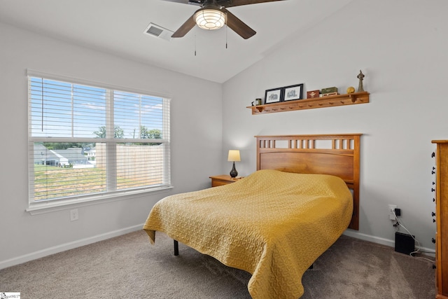 carpeted bedroom with ceiling fan and vaulted ceiling