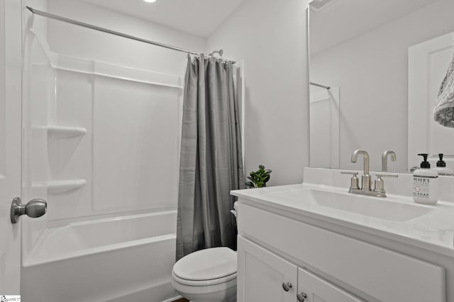 full bathroom featuring shower / bath combination with curtain, vanity, and toilet