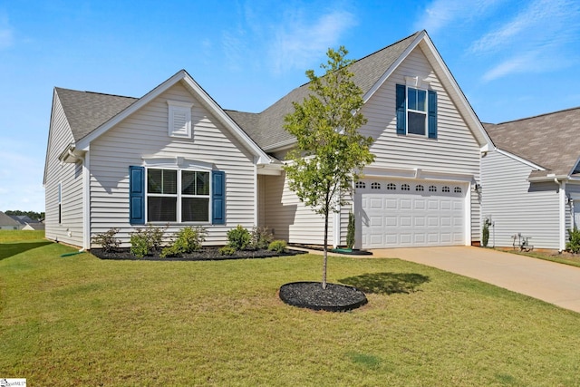 view of front of property featuring a garage and a front yard