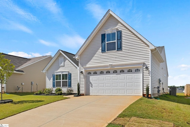 view of property with a garage, central air condition unit, and a front yard