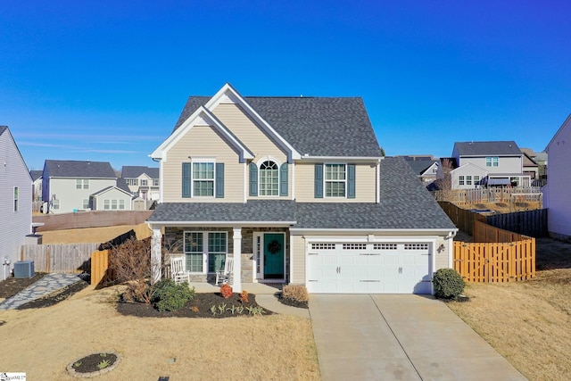 view of property featuring central AC and a garage