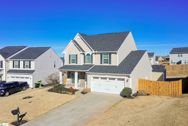 front of property featuring a front yard and a garage