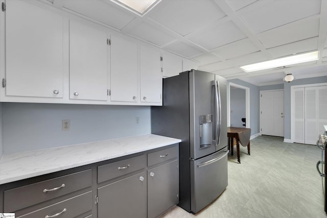 kitchen featuring white cabinets, light stone countertops, and appliances with stainless steel finishes