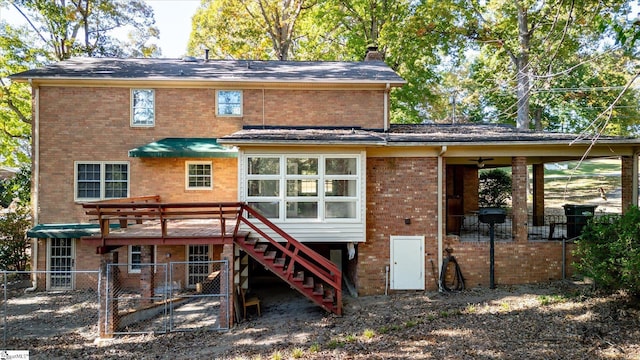 back of property with ceiling fan