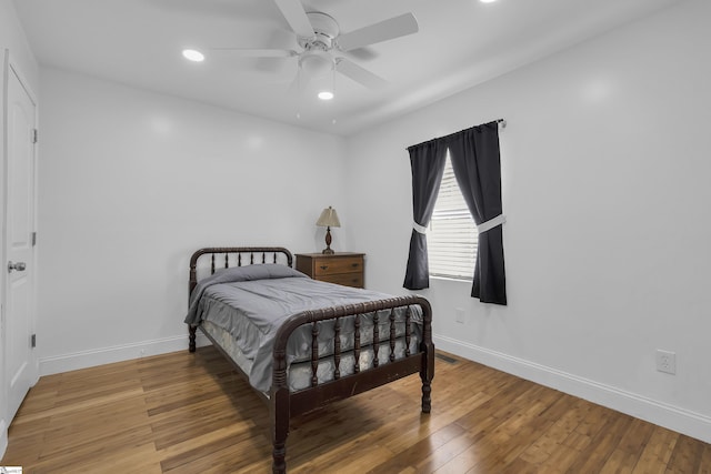 bedroom featuring hardwood / wood-style flooring and ceiling fan