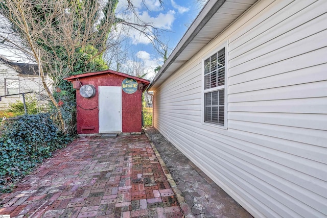 view of patio / terrace with a storage shed