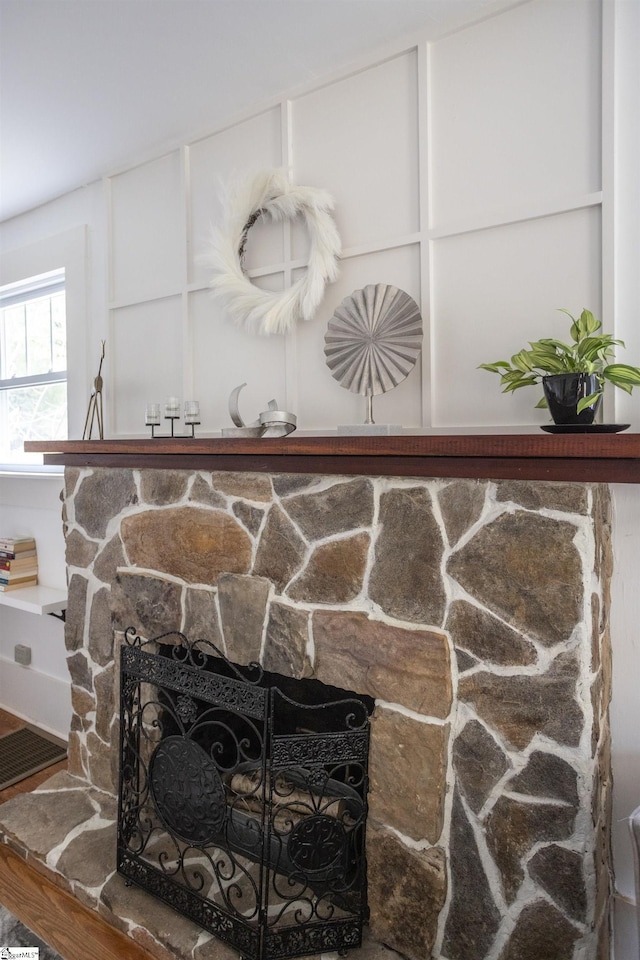 interior details with a fireplace and hardwood / wood-style floors