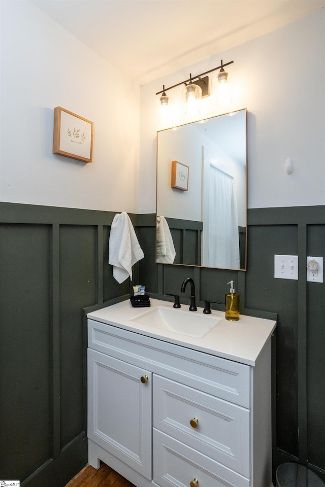 bathroom featuring wood-type flooring and vanity