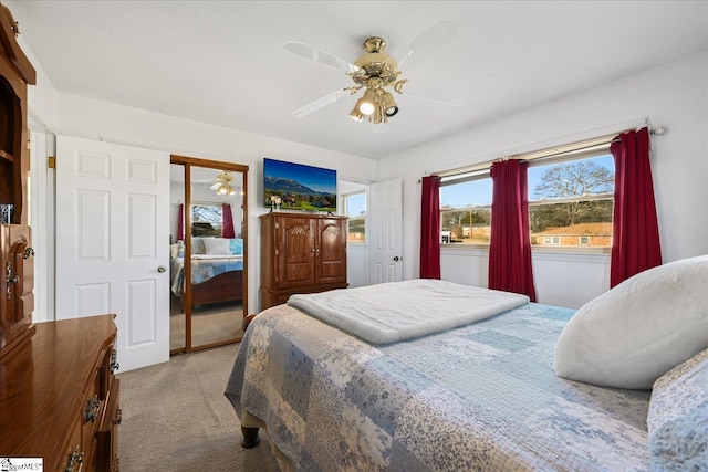 carpeted bedroom featuring ceiling fan