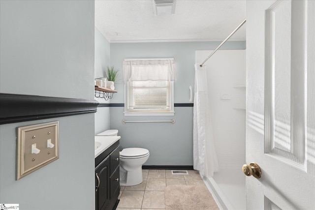 bathroom with curtained shower, tile patterned flooring, a textured ceiling, toilet, and vanity