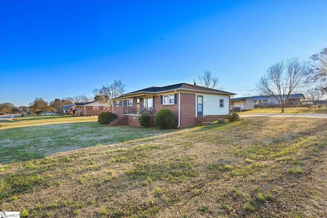 view of property exterior featuring a lawn