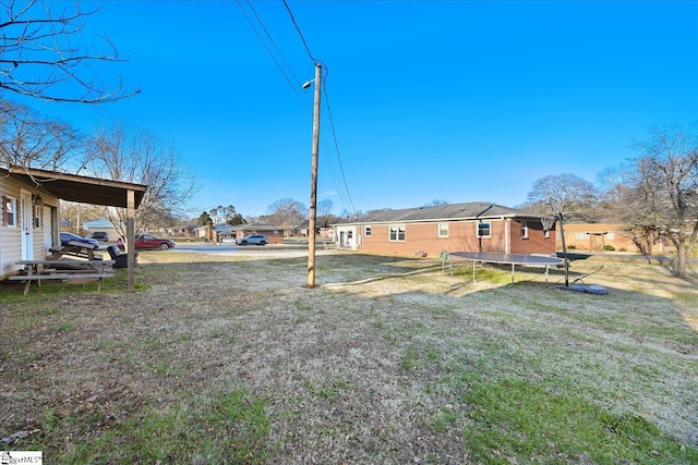 view of yard with a trampoline