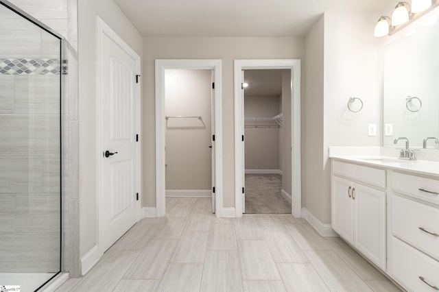 bathroom with vanity and walk in shower