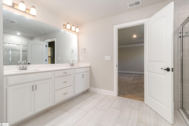 bathroom with vanity and an enclosed shower