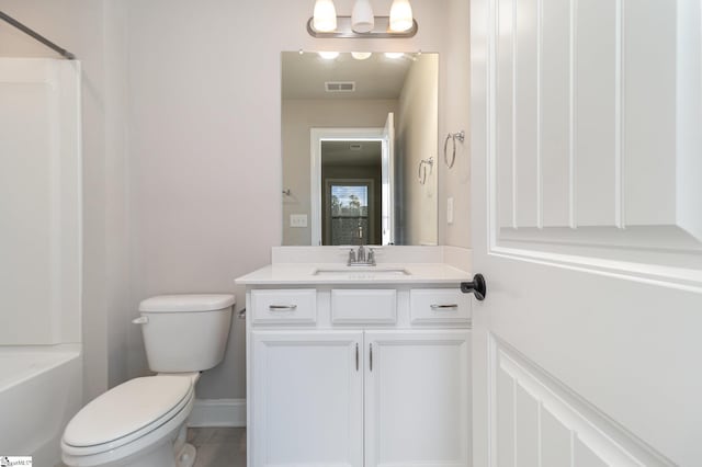 full bathroom with shower / tub combination, vanity, and toilet