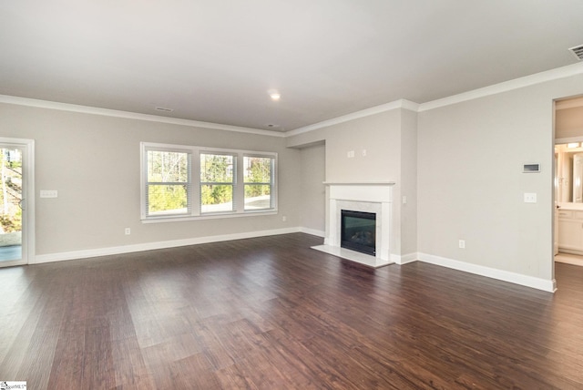 unfurnished living room featuring a high end fireplace, dark hardwood / wood-style floors, and ornamental molding