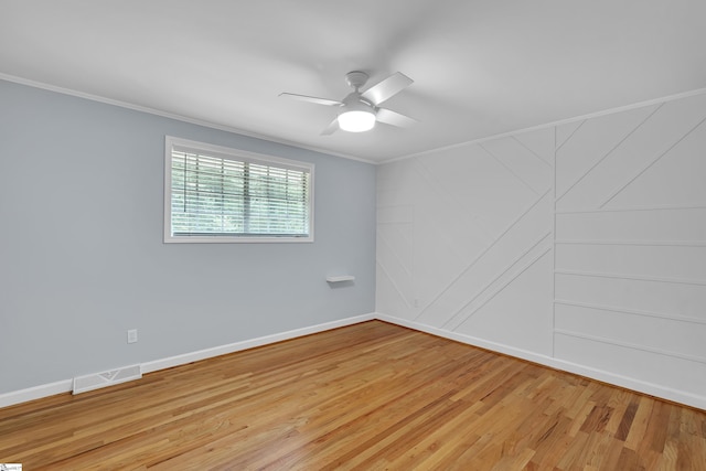 unfurnished room with ceiling fan, light hardwood / wood-style flooring, and ornamental molding