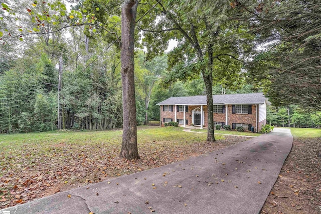 ranch-style house with a front lawn