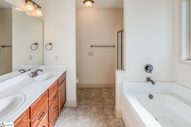 bathroom featuring a bathtub, vanity, and toilet