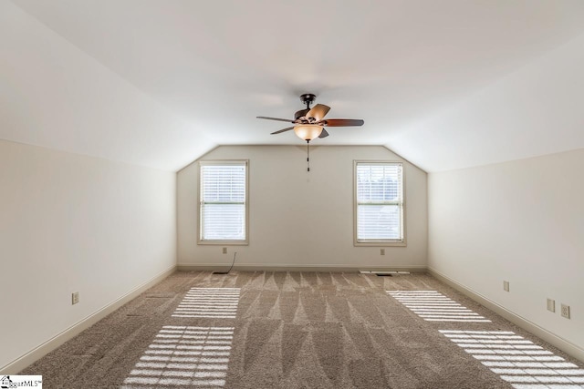 bonus room featuring light colored carpet, ceiling fan, and lofted ceiling