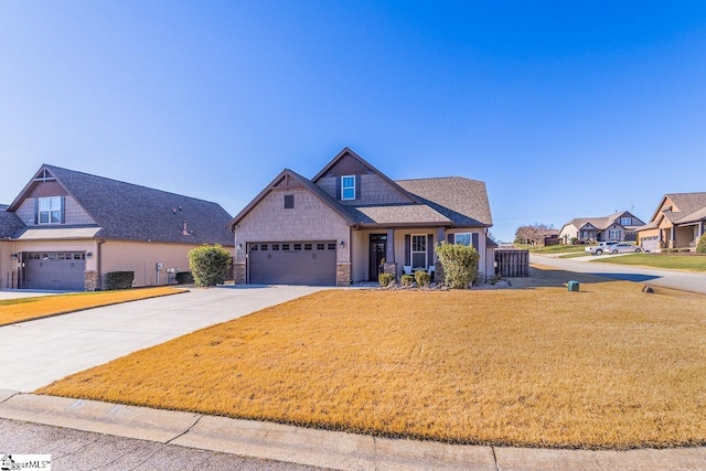 craftsman house featuring a garage and a front lawn