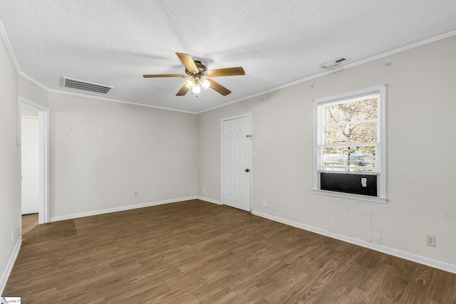 unfurnished room featuring ceiling fan, dark hardwood / wood-style flooring, ornamental molding, and a textured ceiling