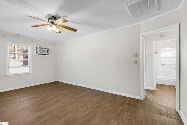 empty room with dark hardwood / wood-style floors, ceiling fan, ornamental molding, a textured ceiling, and a wall mounted AC