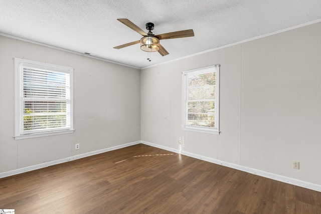 unfurnished room featuring dark hardwood / wood-style floors, ceiling fan, ornamental molding, and a textured ceiling