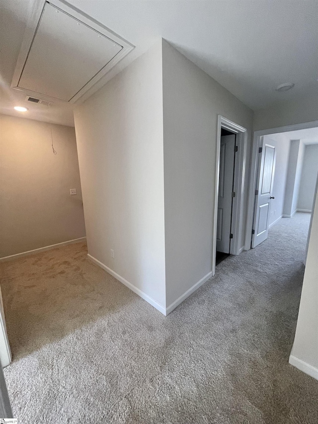 hallway featuring carpet flooring