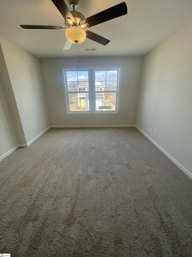 carpeted empty room with ceiling fan