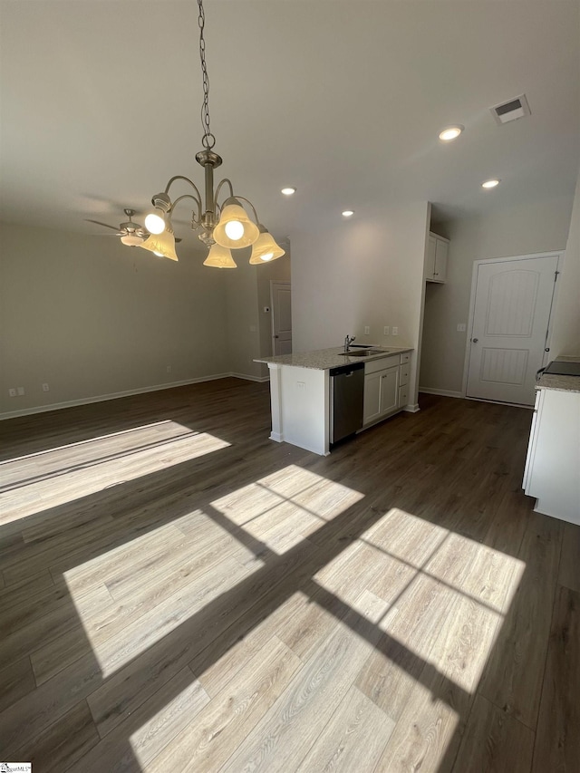 kitchen featuring sink, dark hardwood / wood-style flooring, dishwasher, pendant lighting, and white cabinets