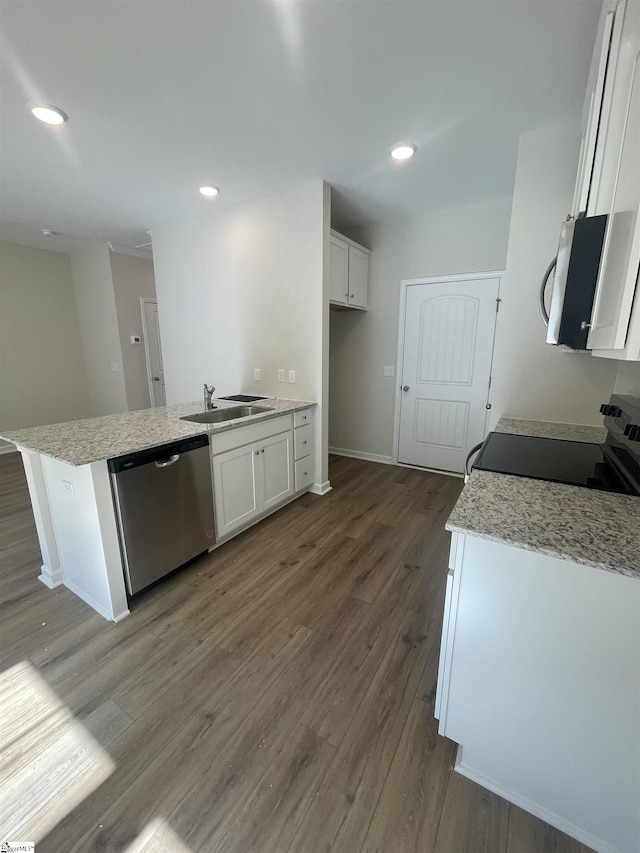 kitchen featuring white cabinetry, sink, dark hardwood / wood-style flooring, and stainless steel appliances