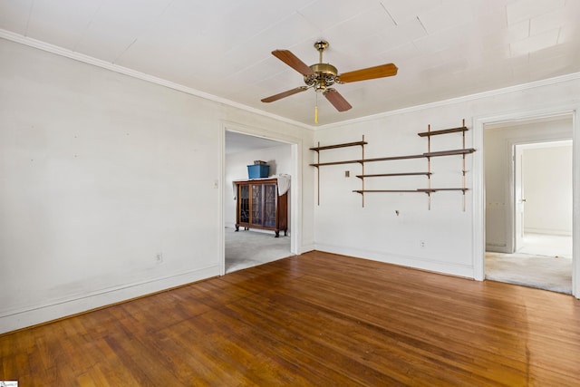 empty room with ceiling fan, wood-type flooring, and ornamental molding