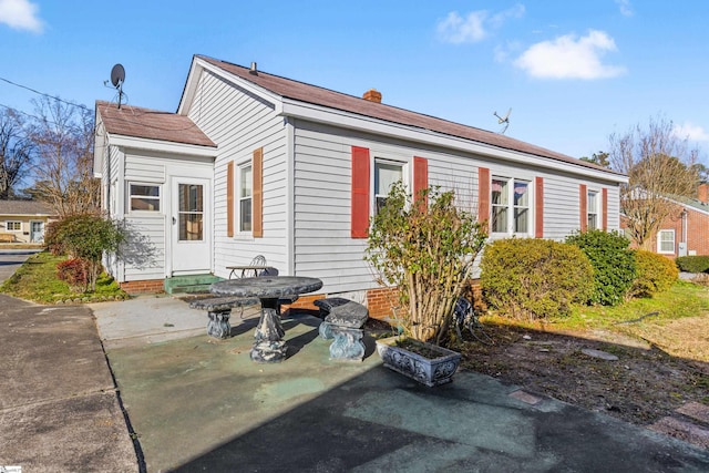 rear view of property featuring a patio area