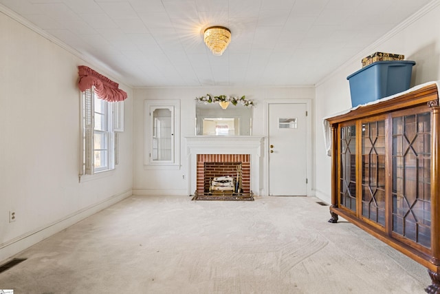 unfurnished living room featuring a fireplace, carpet floors, and ornamental molding