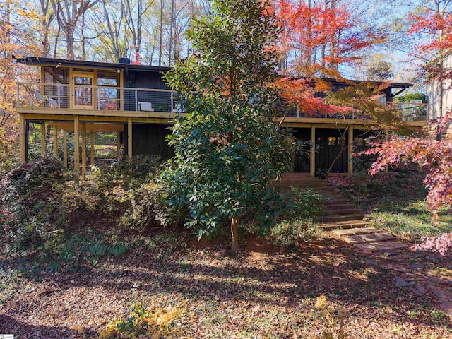 back of house featuring a deck