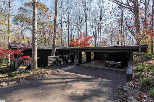 view of front of home with a carport