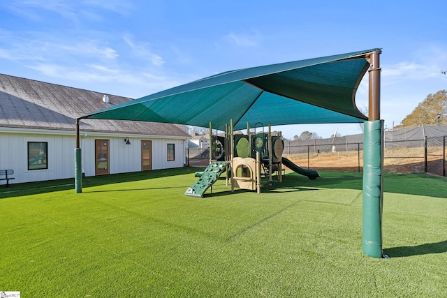 view of jungle gym with a lawn