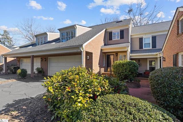 view of front of property with a porch and a garage