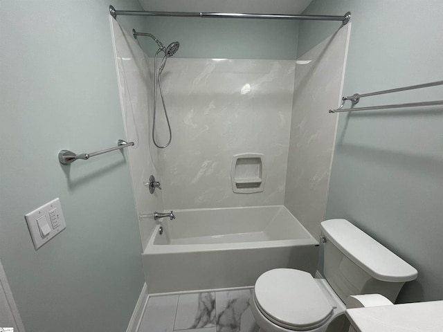 bathroom featuring washtub / shower combination and toilet