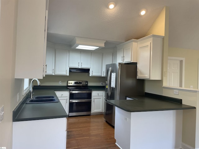 kitchen with white cabinetry, sink, stainless steel appliances, kitchen peninsula, and a textured ceiling