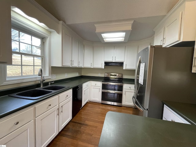 kitchen featuring dark hardwood / wood-style flooring, white cabinetry, sink, and appliances with stainless steel finishes