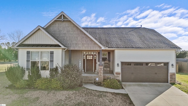 craftsman house featuring covered porch and a garage