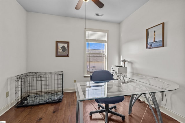 office area featuring ceiling fan and dark wood-type flooring