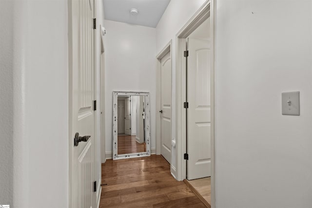 hallway with light hardwood / wood-style flooring